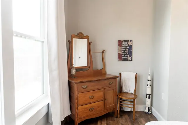 a room with furniture and a mirror