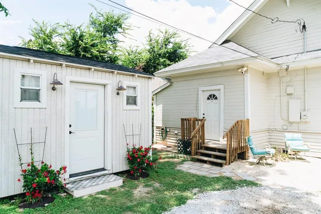 a backyard of a house with yard and outdoor seating