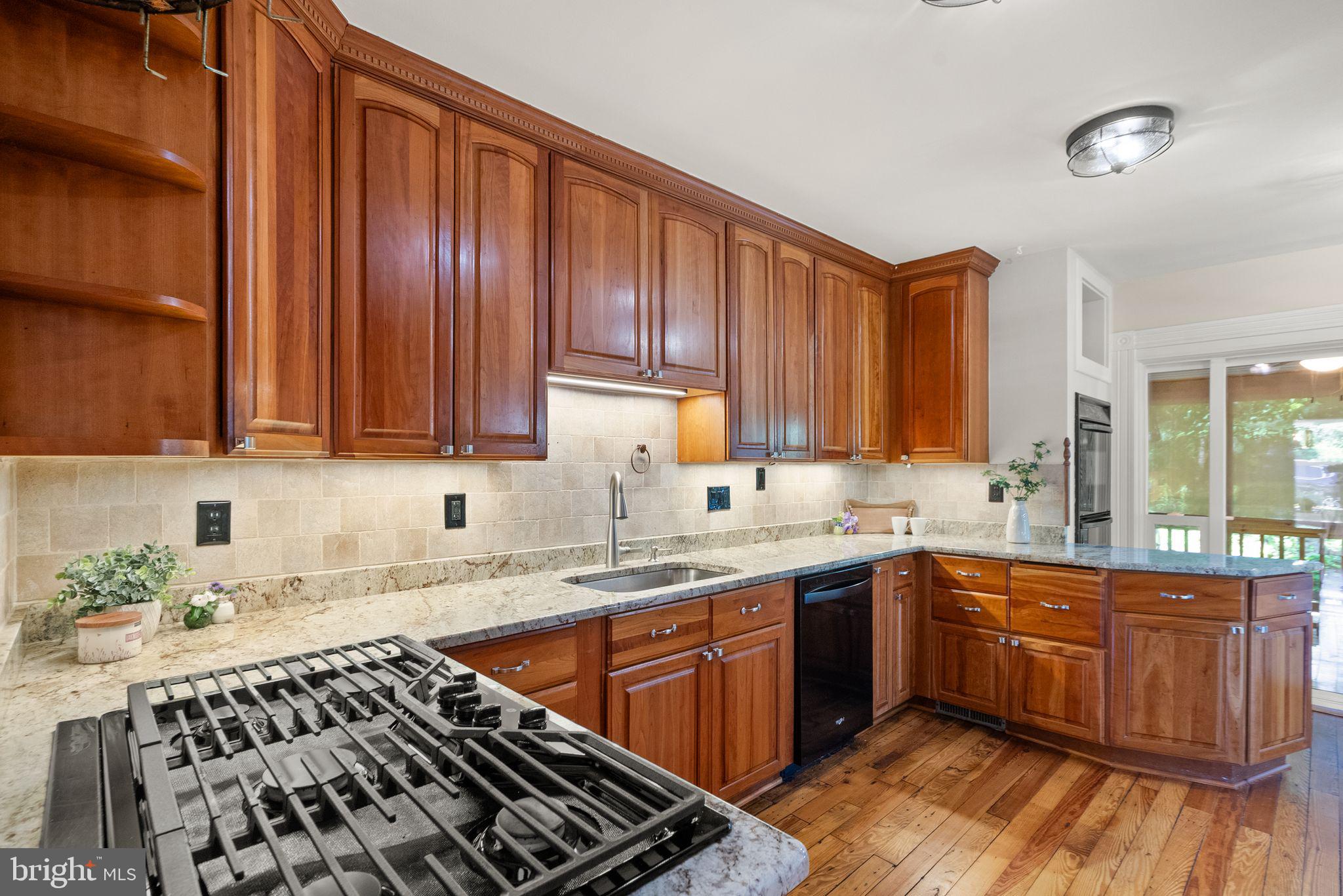 37151 Branchriver Road Purcellville, VA 20132 - Photo 24 of 63 a kitchen with a sink stove and cabinets