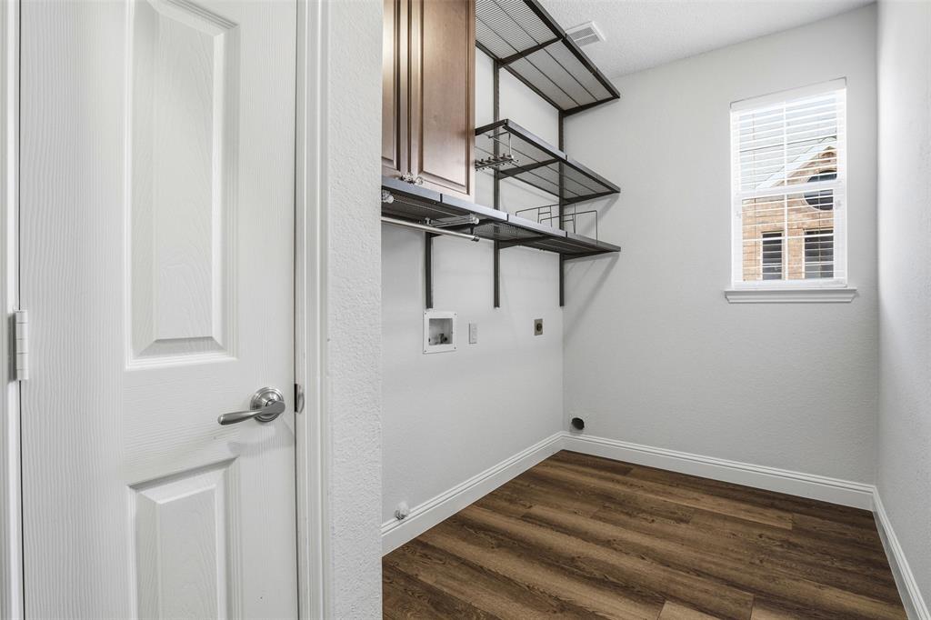 4425 Foxtail Lane Plano, TX 75024 - Photo 16 of 33 a view of a room with rack on the wall