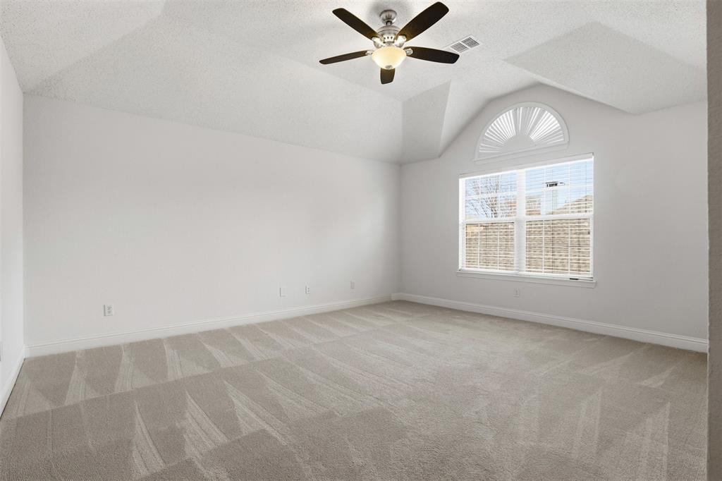4425 Foxtail Lane Plano, TX 75024 - Photo 23 of 33 an empty room with a window and a fan
