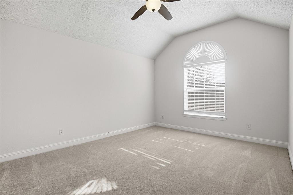 4425 Foxtail Lane Plano, TX 75024 - Photo 25 of 33 an empty room with ceiling fan and window