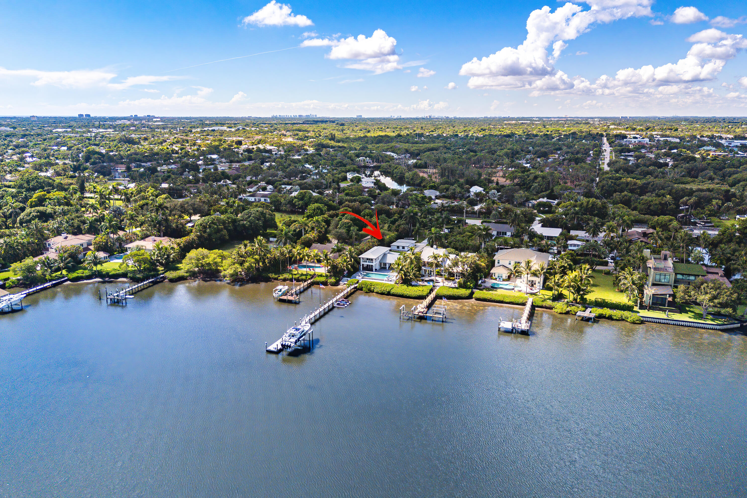 5447 Center Street Jupiter, FL 33458 - Photo 60 of 60 an aerial view of a swimming pool with lawn chairs