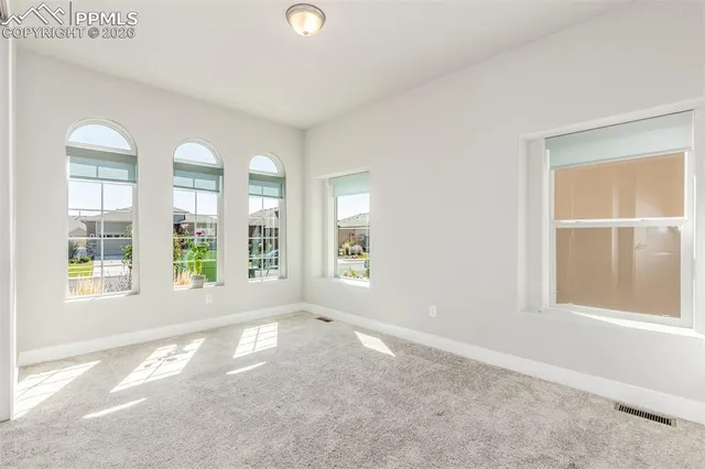 an empty room with windows