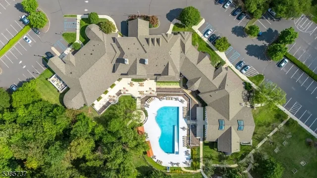 an aerial view of residential house with outdoor space and swimming pool