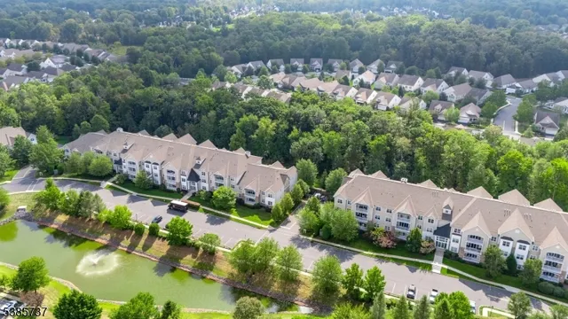 an aerial view of house with yard swimming pool and outdoor seating