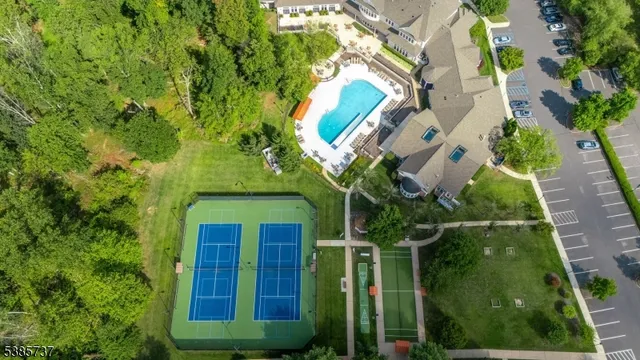 a view of a house with a tree in a garden