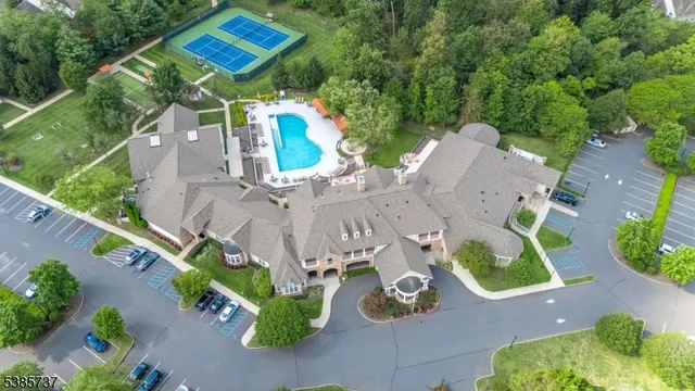 an aerial view of a house with garden space and street view