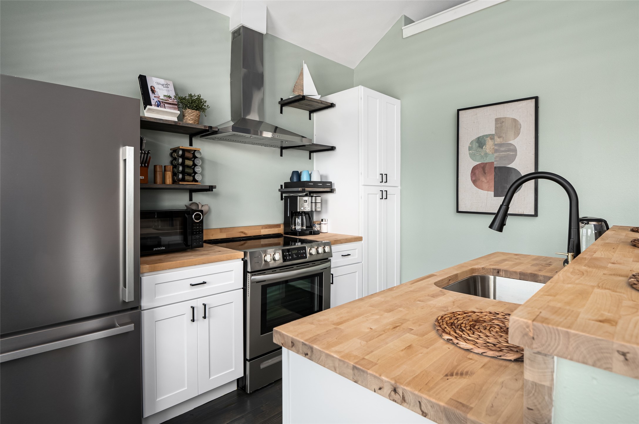 1084 Johnson Road Port Bolivar, TX 77650 - Photo 12 of 39 a kitchen with stainless steel appliances granite countertop a refrigerator and a sink