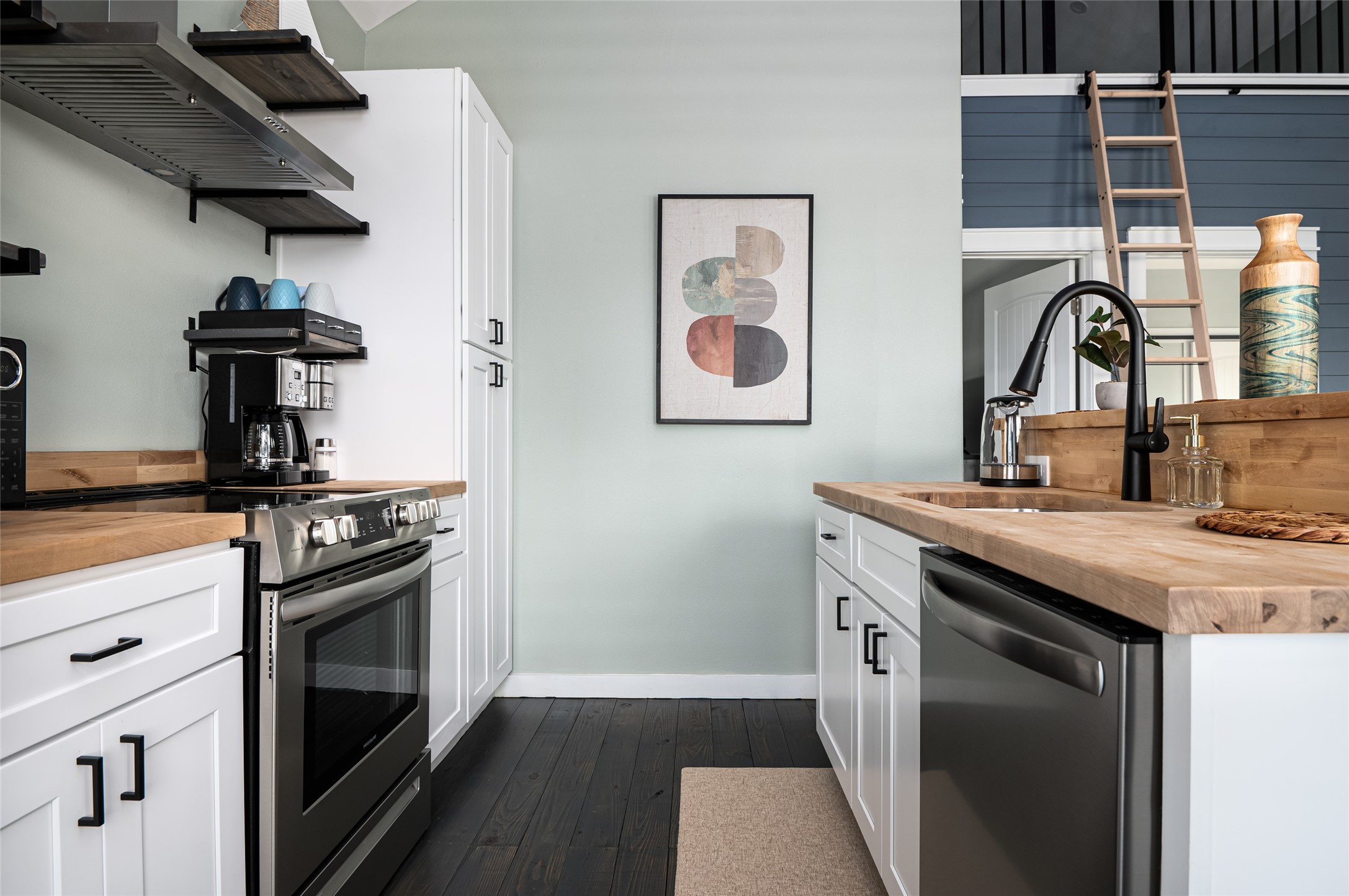1084 Johnson Road Port Bolivar, TX 77650 - Photo 13 of 39 a kitchen with stainless steel appliances granite countertop a stove and a sink
