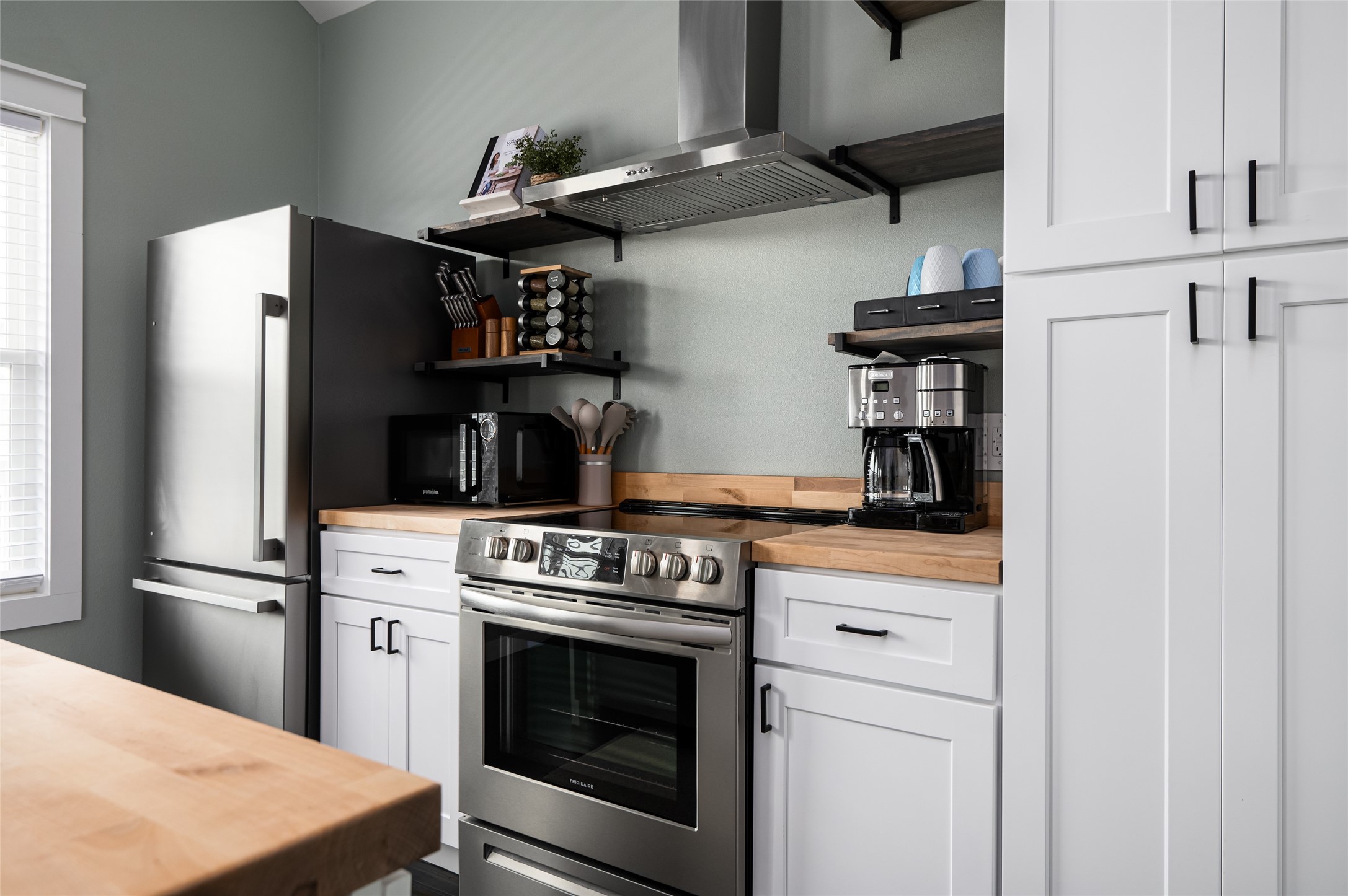 1084 Johnson Road Port Bolivar, TX 77650 - Photo 14 of 39 a kitchen with stainless steel appliances granite countertop a refrigerator and a stove