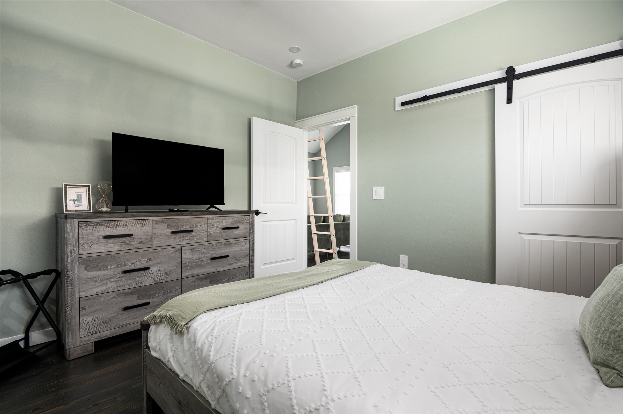 1084 Johnson Road Port Bolivar, TX 77650 - Photo 17 of 39 a bedroom with a bed and a flat screen tv