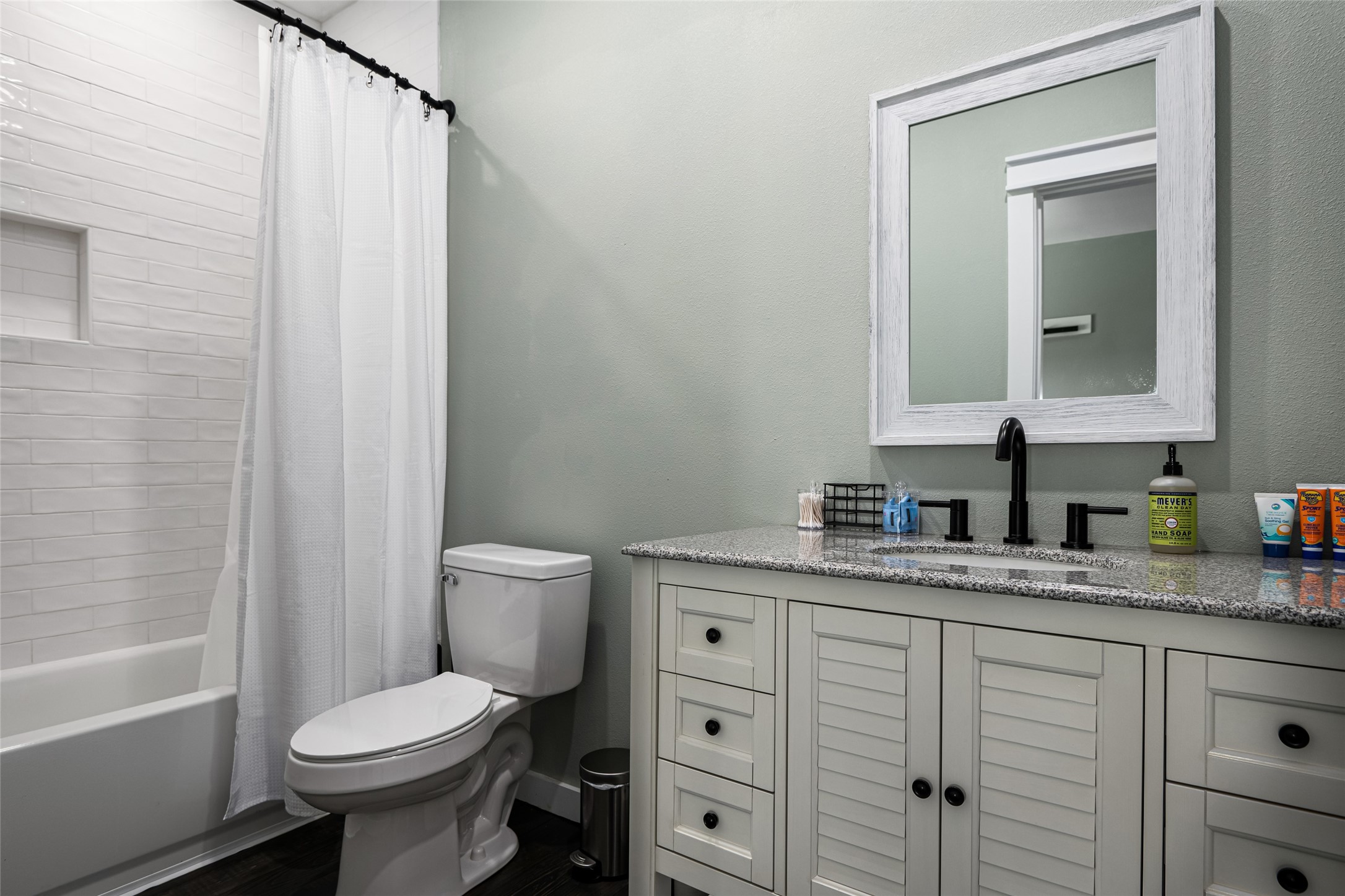 1084 Johnson Road Port Bolivar, TX 77650 - Photo 20 of 39 a bathroom with a granite countertop sink toilet and shower