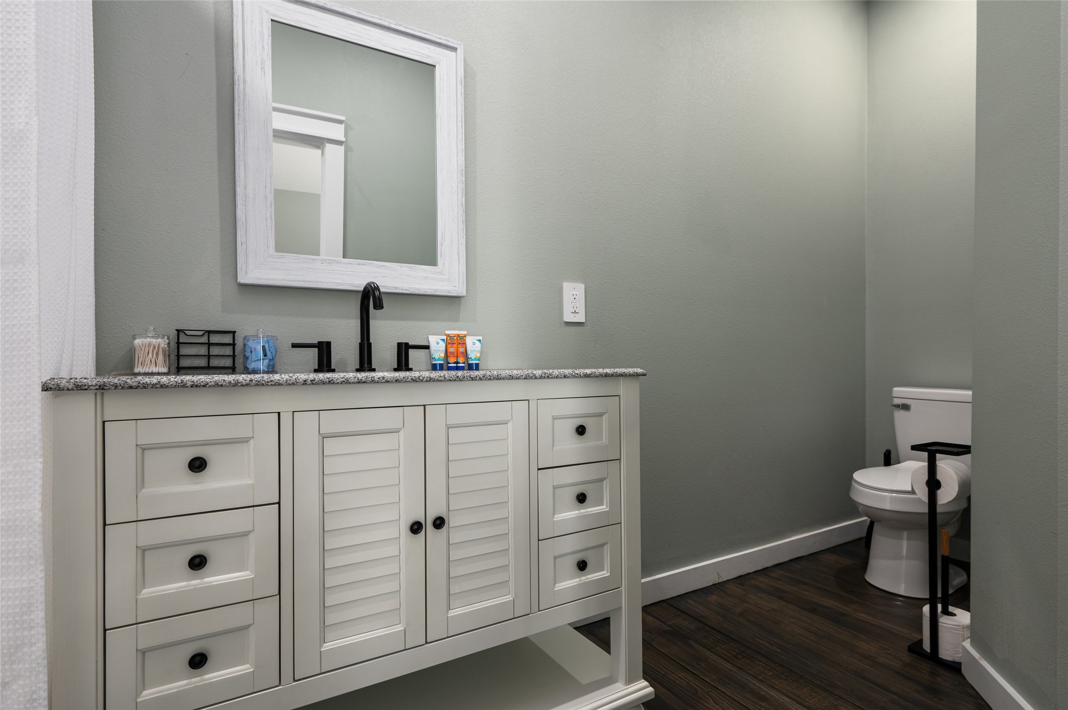 1084 Johnson Road Port Bolivar, TX 77650 - Photo 22 of 39 a bathroom with a toilet sink and mirror