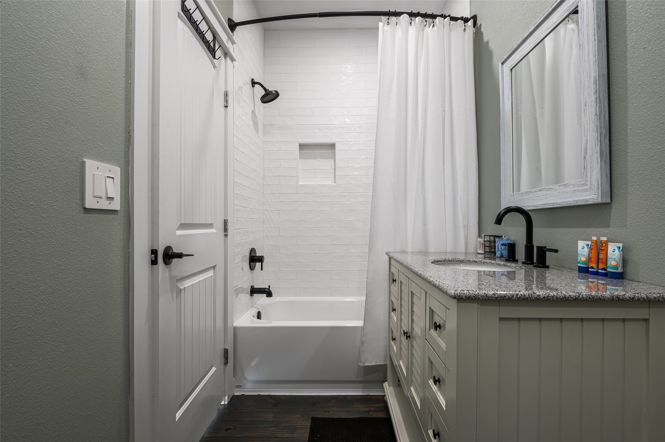 1084 Johnson Road Port Bolivar, TX 77650 - Photo 23 of 39 a bathroom with a granite countertop sink and a mirror