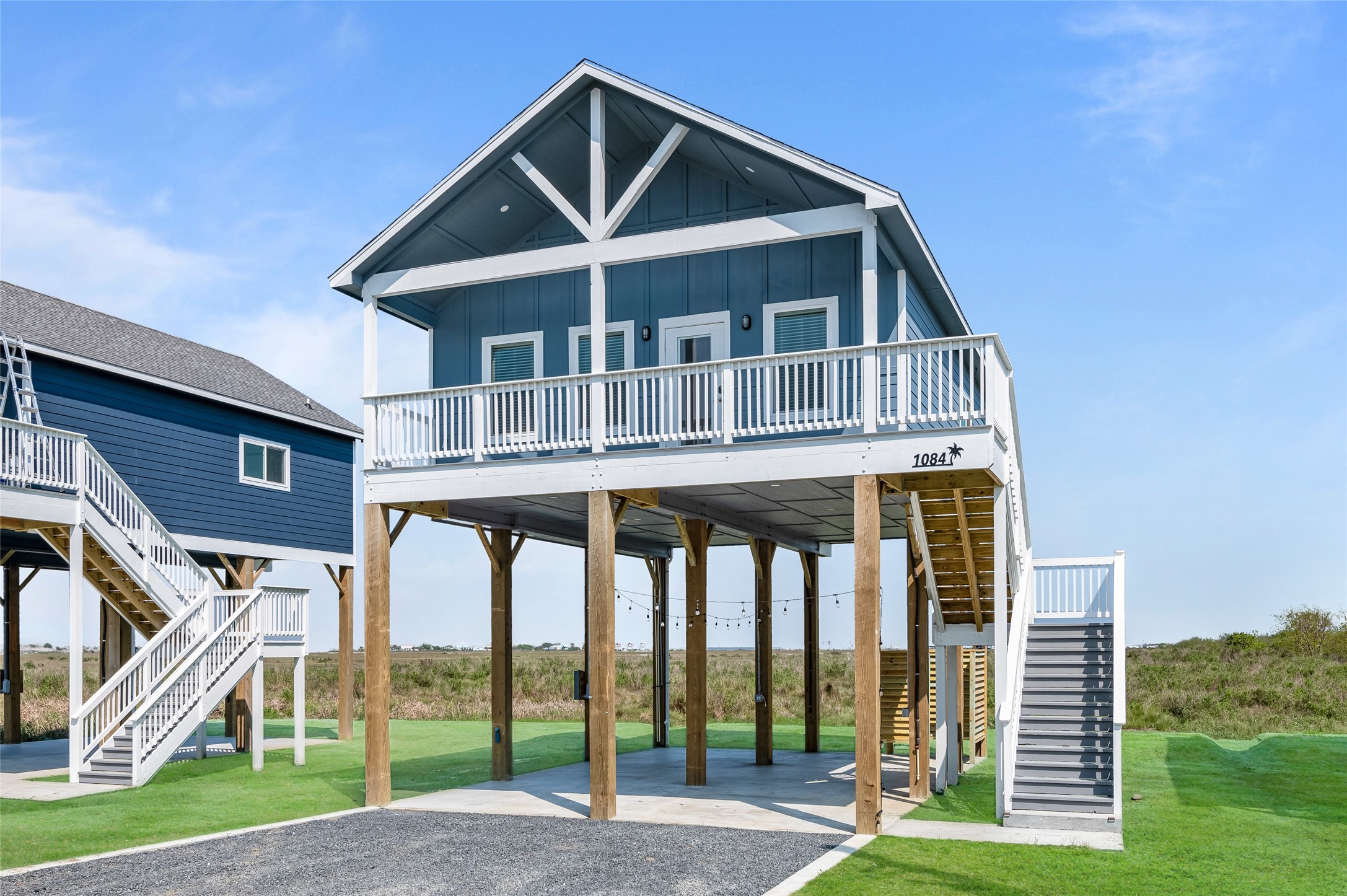 1084 Johnson Road Port Bolivar, TX 77650 - Photo 28 of 39 a view of a house with a yard and large trees