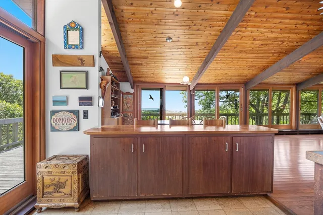 a view of a room with a large window