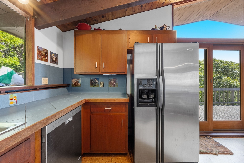 25 Resolution Road Truro, MA 02666 - Photo 14 of 42 a kitchen with stainless steel appliances granite countertop a refrigerator and a sink