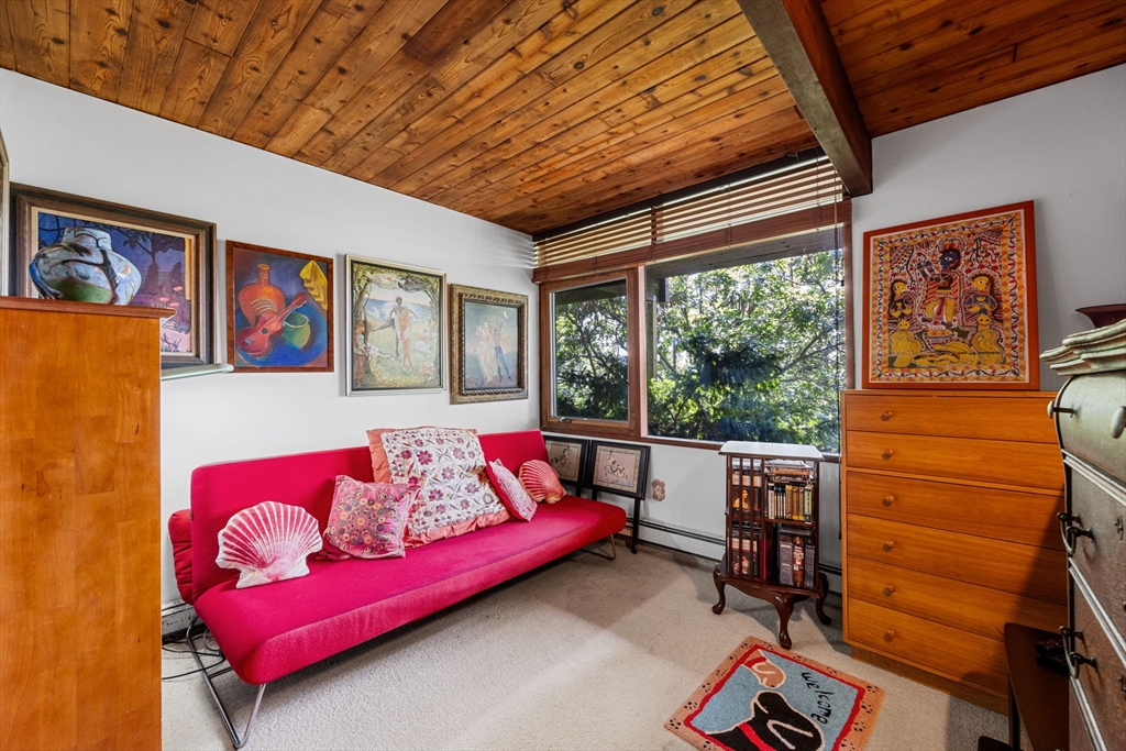 25 Resolution Road Truro, MA 02666 - Photo 15 of 42 a living room with furniture a rug and a large window