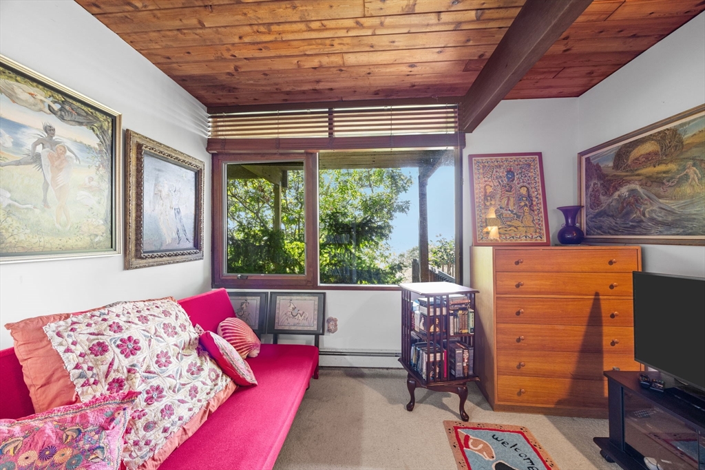 25 Resolution Road Truro, MA 02666 - Photo 16 of 42 a living room with furniture and a large window
