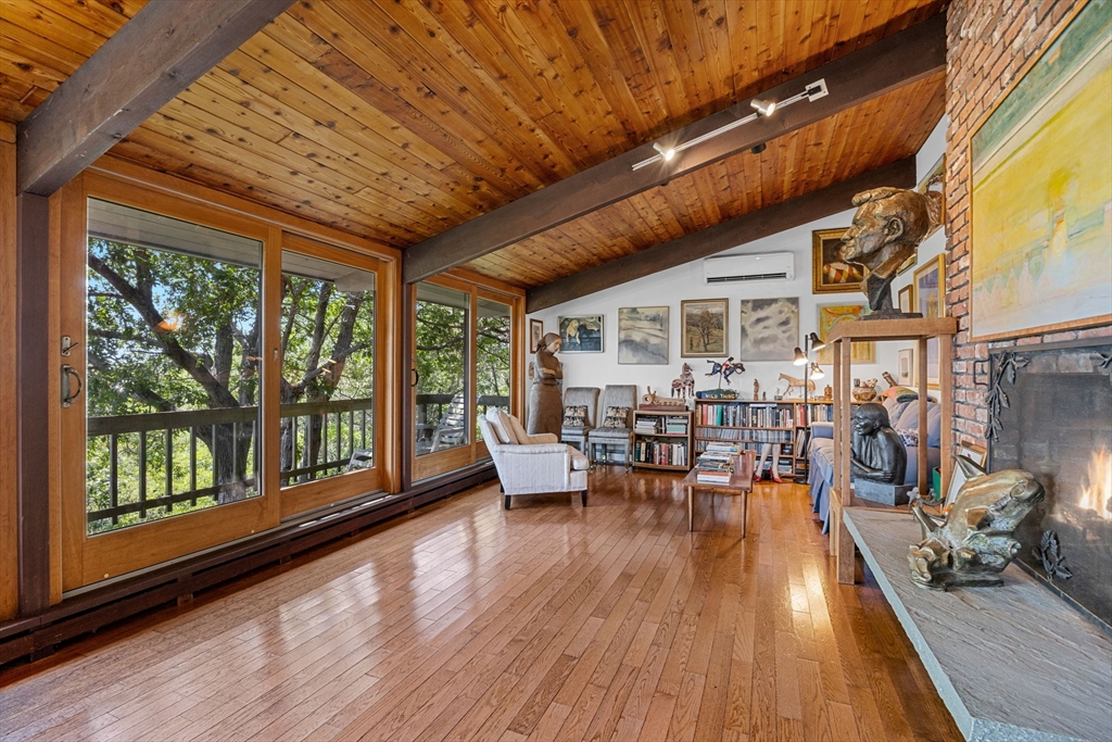 25 Resolution Road Truro, MA 02666 - Photo 2 of 42 a outdoor space with lots of furniture and wooden floor