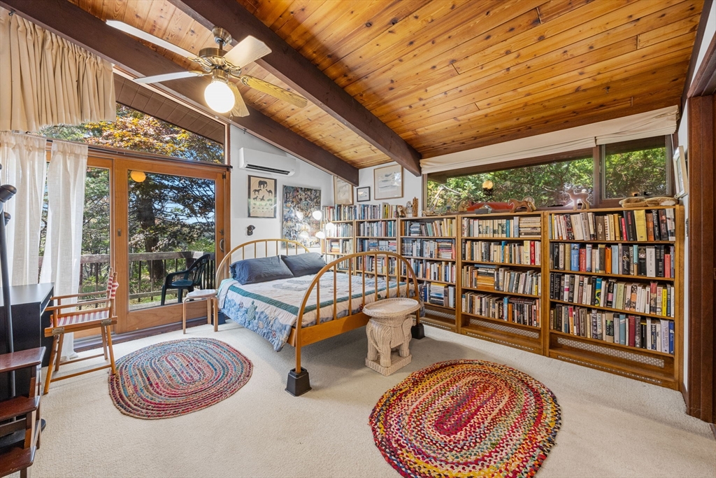 25 Resolution Road Truro, MA 02666 - Photo 24 of 42 a bedroom with furniture and a large window