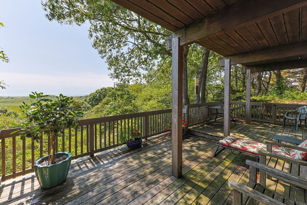 25 Resolution Road Truro, MA 02666 - Photo 28 of 42 a view of a balcony with chair and wooden floor