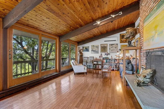 a outdoor space with lots of furniture and wooden floor