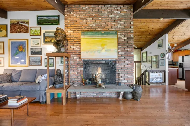 a view of a living room and kitchen with furniture