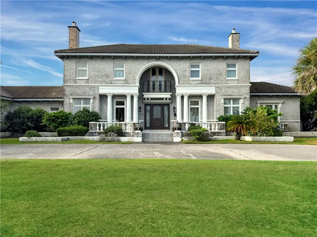 a front view of a house with swimming pool