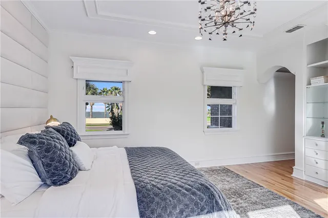 a bathroom with a double vanity sink mirror and a bathtub