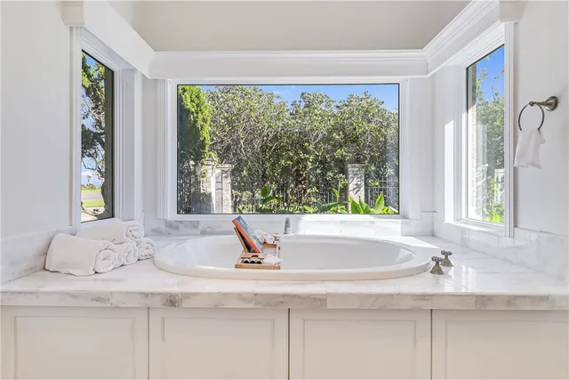 a bedroom with bed and wooden floor
