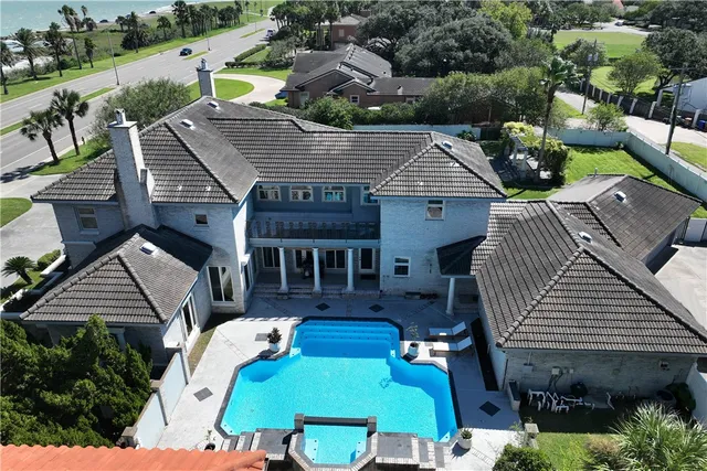 an aerial view of a house with patio outdoor seating