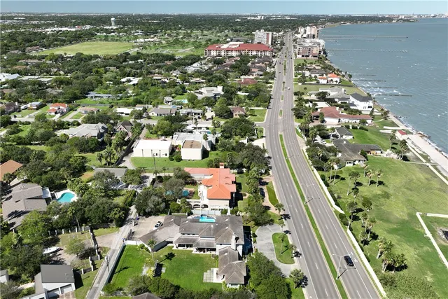 an aerial view of residential houses and outdoor space