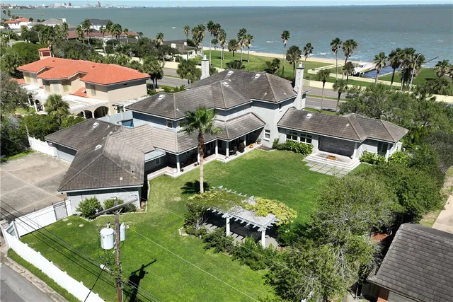 an aerial view of a house with a garden