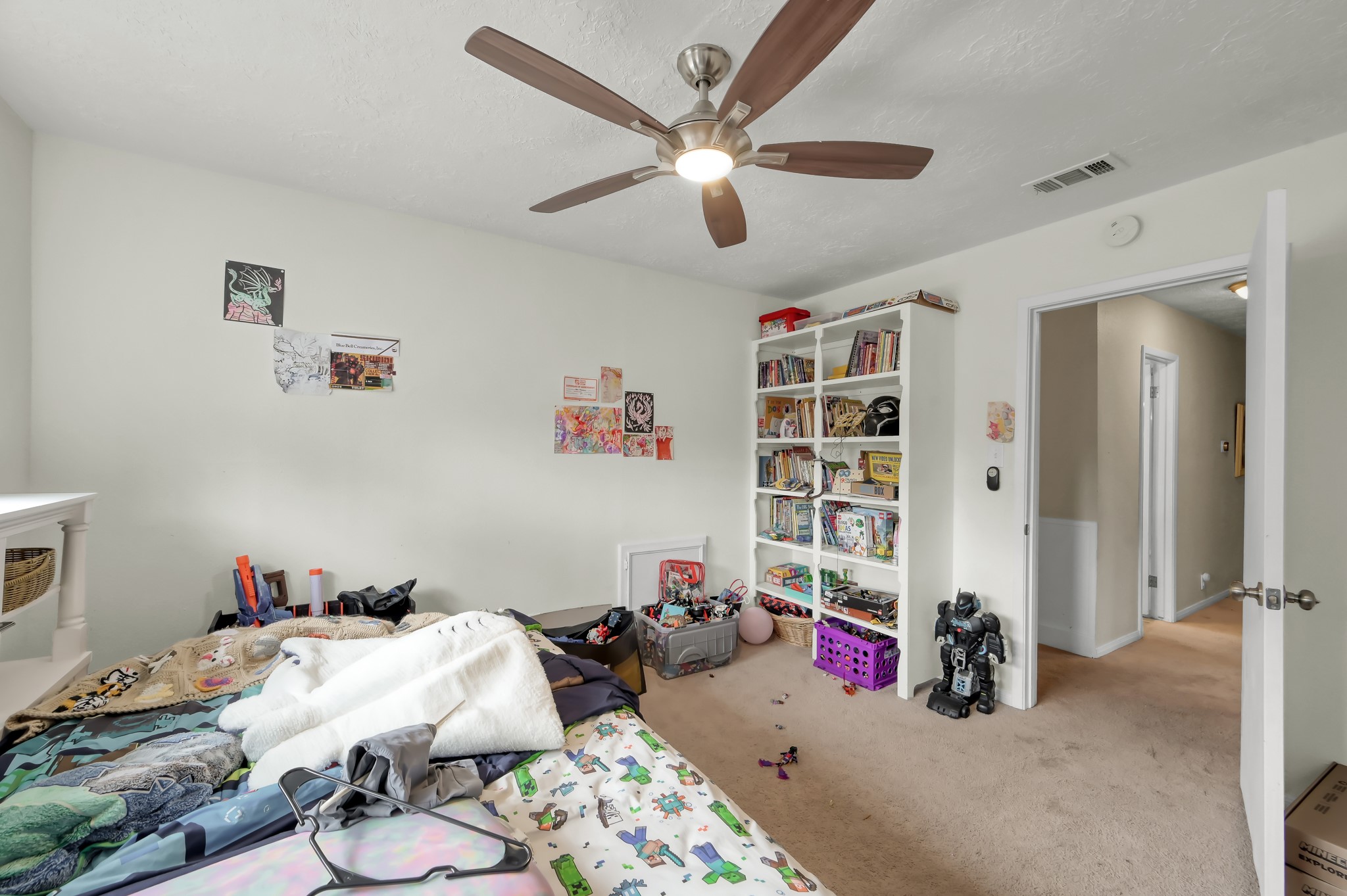 25610 Walnut Grove Circle Spring, TX 77380 - Photo 21 of 29 a bedroom with furniture and a chandelier