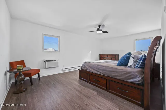 a bed room with a bed and a chair