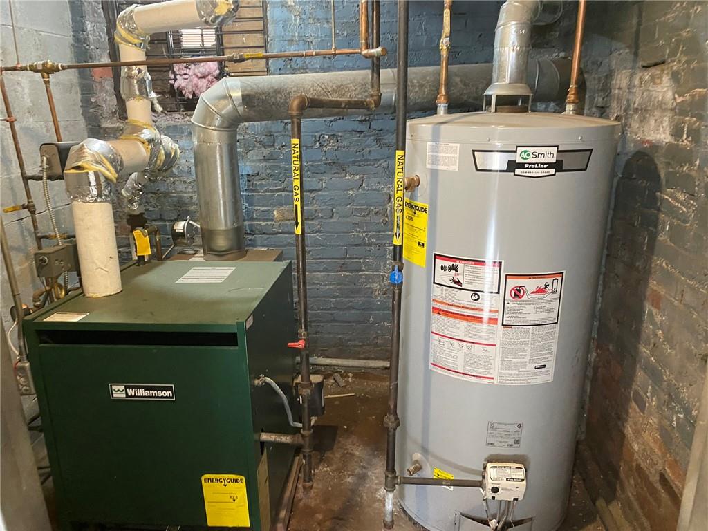 321 Milford Street Brooklyn, NY 11208 - Photo 16 of 31 a utility room with dryer and washer