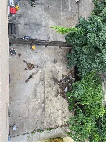 a view of a house with wooden fence