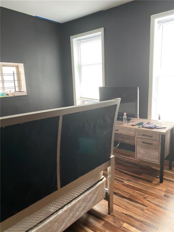 321 Milford Street Brooklyn, NY 11208 - Photo 10 of 31 a room with a window and wooden floor
