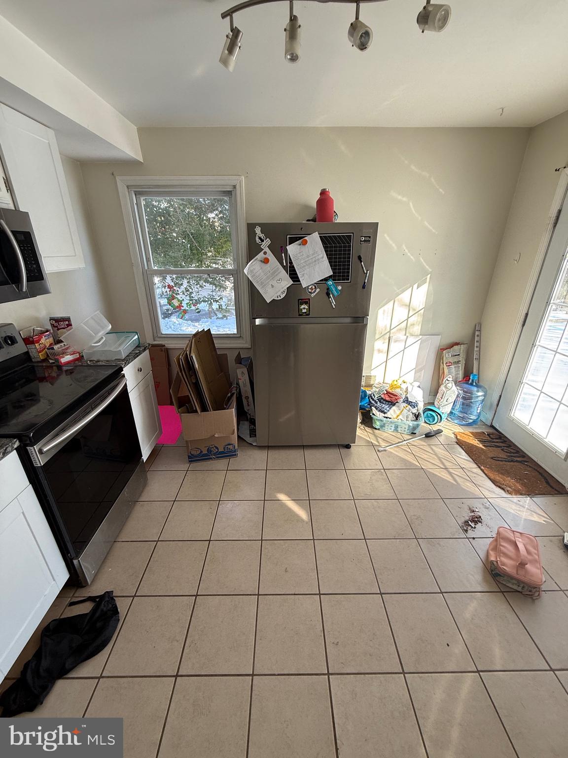 54 North Hills Drive Rising Sun, MD 21911 - Photo 9 of 13 a living room with furniture and a floor to ceiling window
