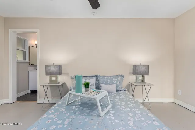 a living room with furniture and a chair