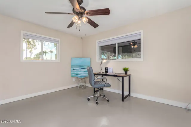 a view of a workspace with furniture