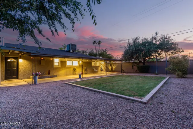 a view of a house with a yard and garage