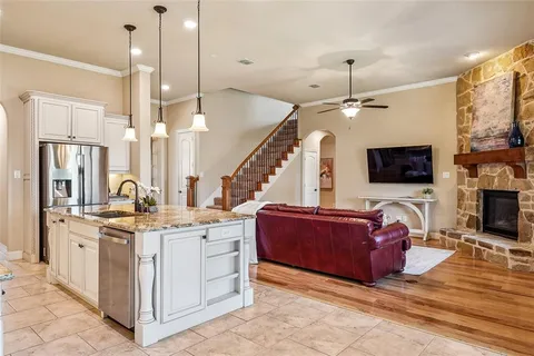 a living room with fireplace furniture and a flat screen tv