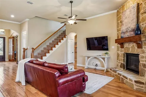 a living room with furniture fireplace and flat screen tv