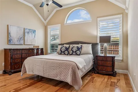 a bedroom with a large bed and a window