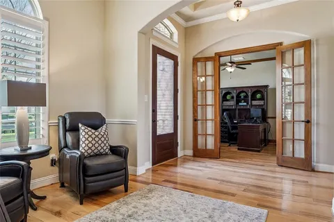 a living room with furniture and a rug
