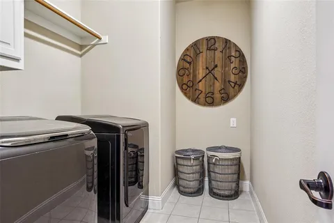 a bathroom with a granite countertop sink toilet and mirror
