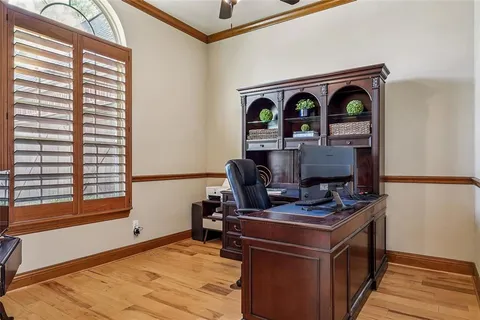 a view of workspace with a window and furniture